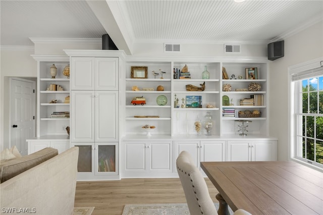 interior space featuring light hardwood / wood-style floors and ornamental molding