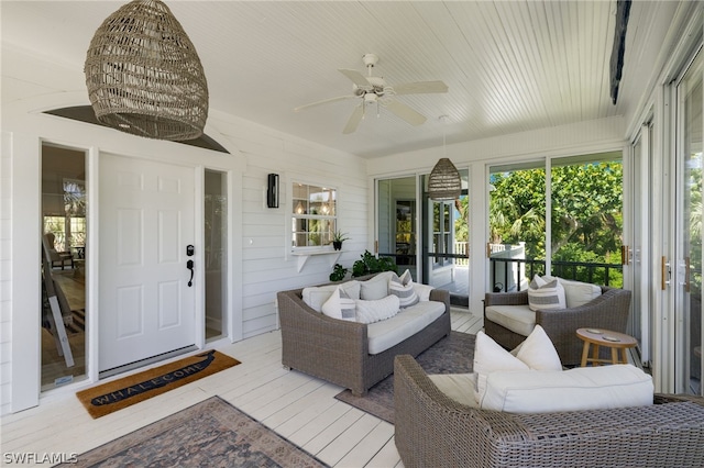 sunroom / solarium with ceiling fan