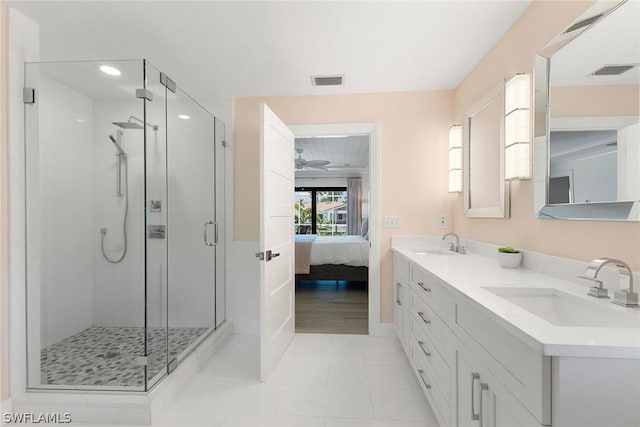 bathroom with tile patterned flooring, vanity, and an enclosed shower