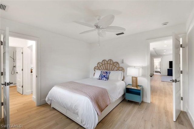 bedroom featuring light hardwood / wood-style floors and ceiling fan