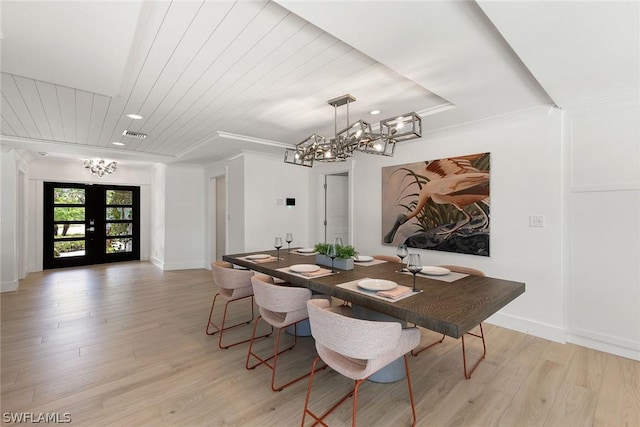 dining space with crown molding, french doors, wooden ceiling, and light hardwood / wood-style flooring