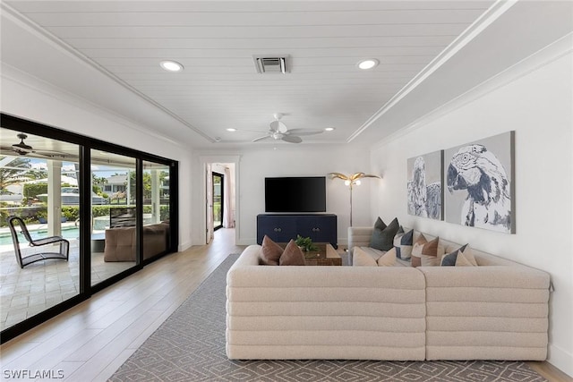 living room featuring hardwood / wood-style floors, ceiling fan, ornamental molding, and wood ceiling