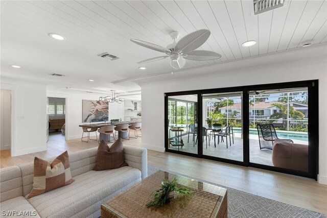 living room featuring ceiling fan, wooden ceiling, and light hardwood / wood-style flooring