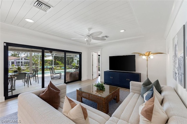 living room featuring light hardwood / wood-style flooring, crown molding, and wood ceiling