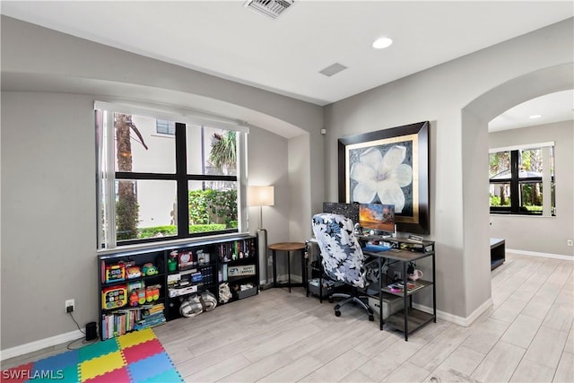 home office with light wood-type flooring