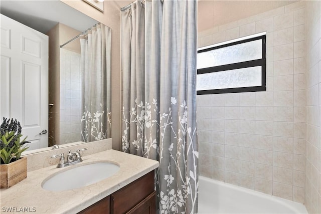 bathroom with shower / bath combo and vanity