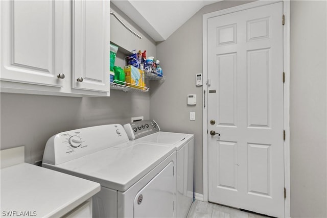 laundry area with cabinets and independent washer and dryer