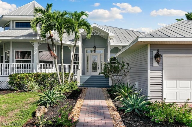 doorway to property with a garage