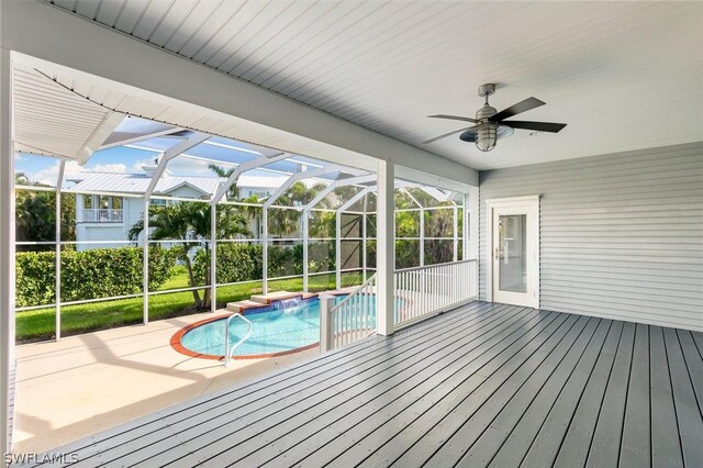 view of pool featuring pool water feature, a patio area, ceiling fan, and a lanai