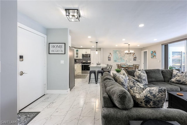 living room featuring an inviting chandelier