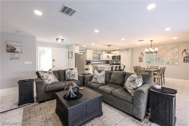 living room featuring a chandelier