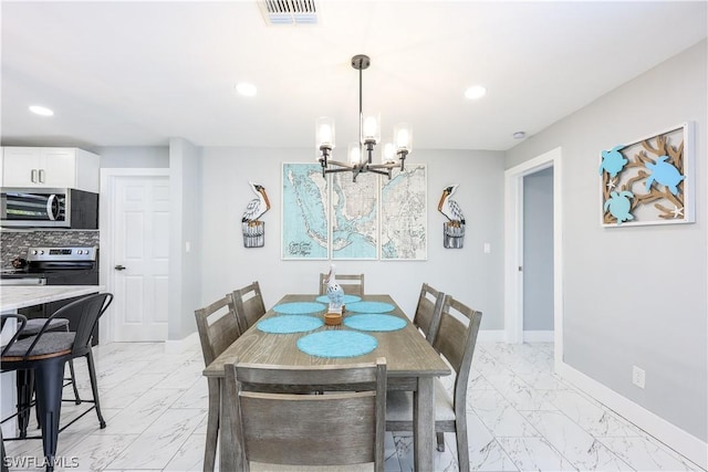 dining space with a notable chandelier