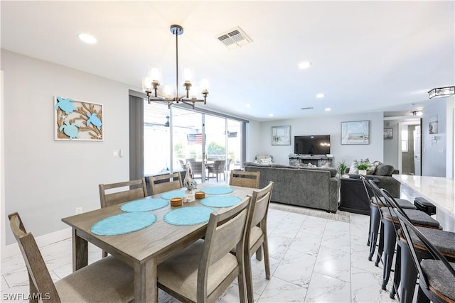 dining room with a chandelier