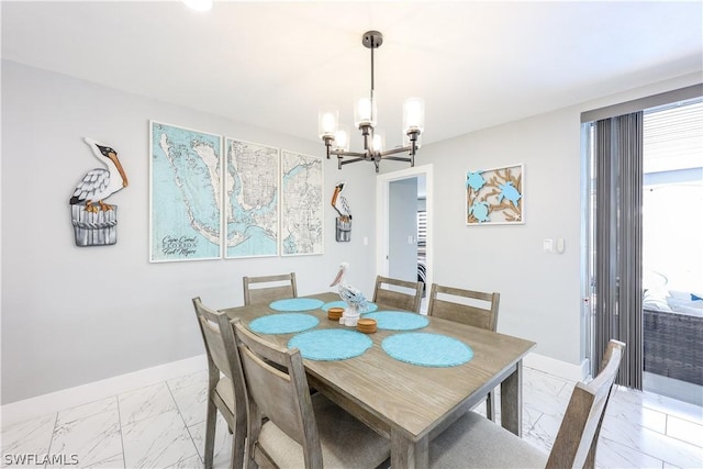 dining room featuring a notable chandelier