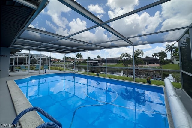 view of pool featuring a water view and glass enclosure