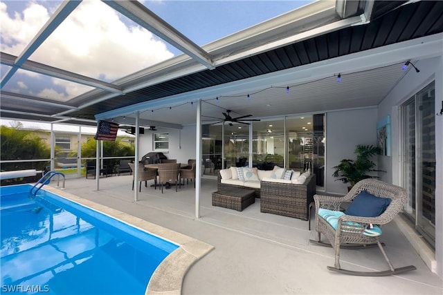 view of pool featuring a patio, a lanai, an outdoor hangout area, and ceiling fan