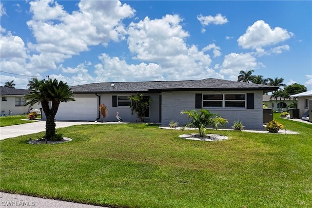 ranch-style home featuring a garage and a front yard