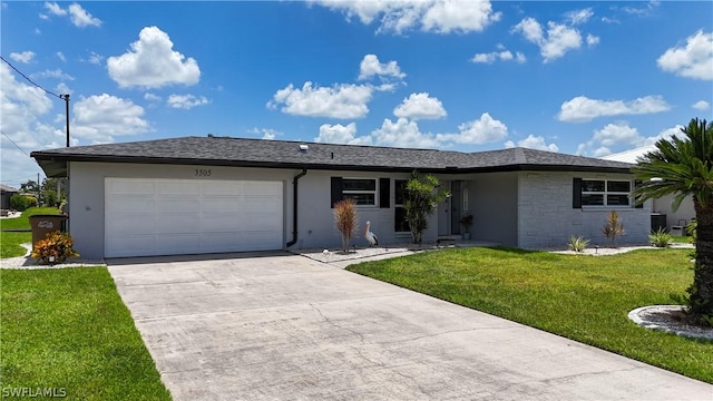 ranch-style home with a garage and a front lawn