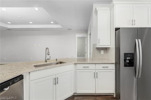 kitchen featuring white cabinets, stainless steel appliances, and sink