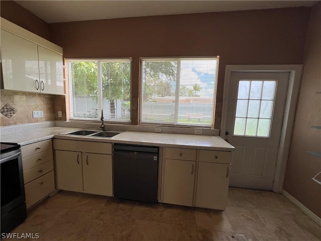 kitchen with stainless steel electric stove, dishwasher, and sink