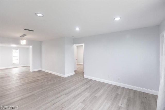 empty room with light hardwood / wood-style floors