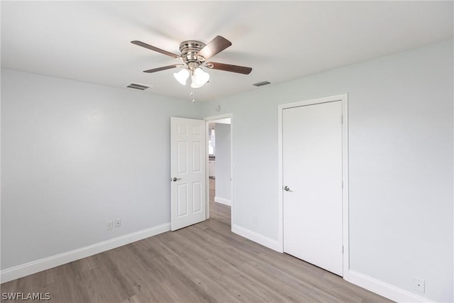 unfurnished bedroom featuring ceiling fan and light hardwood / wood-style floors