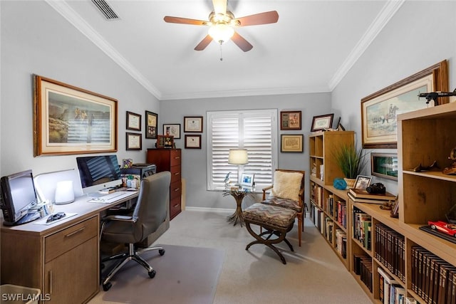 office featuring ornamental molding, visible vents, ceiling fan, and light colored carpet