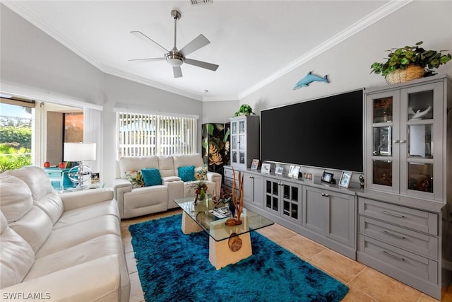 tiled living room with lofted ceiling, ceiling fan, and ornamental molding