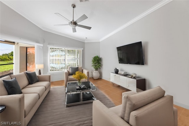 tiled living room with lofted ceiling, ceiling fan, visible vents, and ornamental molding