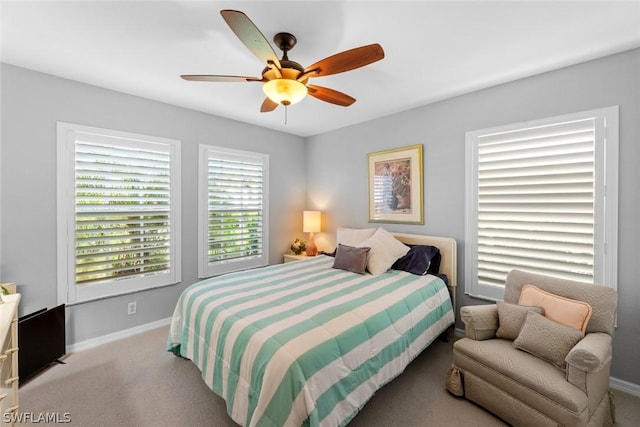 bedroom with baseboards, a ceiling fan, and carpet flooring