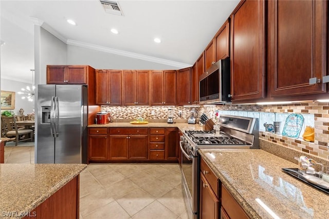 kitchen featuring decorative backsplash, light stone countertops, stainless steel appliances, crown molding, and lofted ceiling