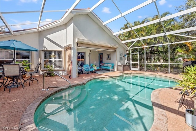 view of swimming pool with a lanai and a patio