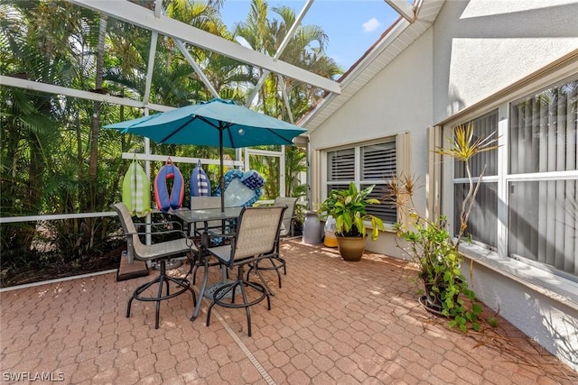 view of patio with a lanai