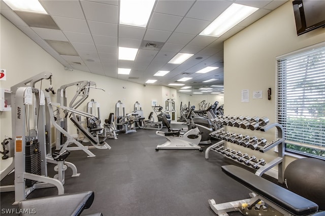 workout area with a paneled ceiling