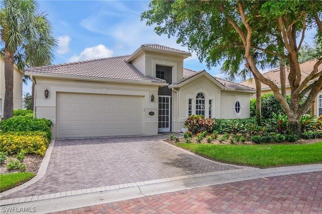 mediterranean / spanish-style house featuring a garage