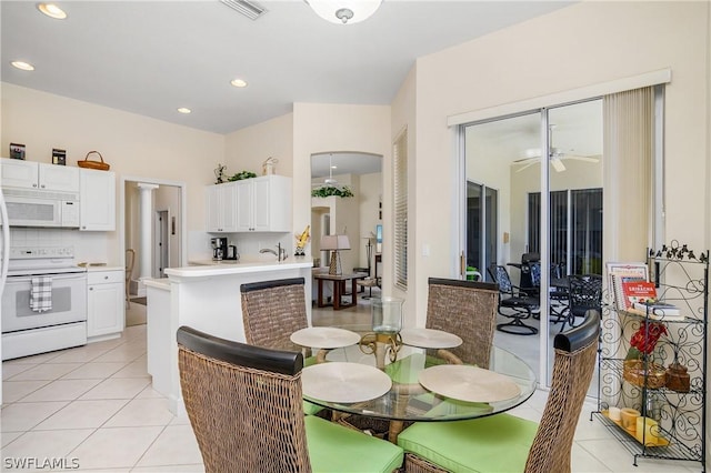 dining room featuring ceiling fan and light tile patterned floors