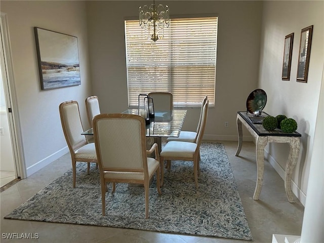 dining space featuring a notable chandelier