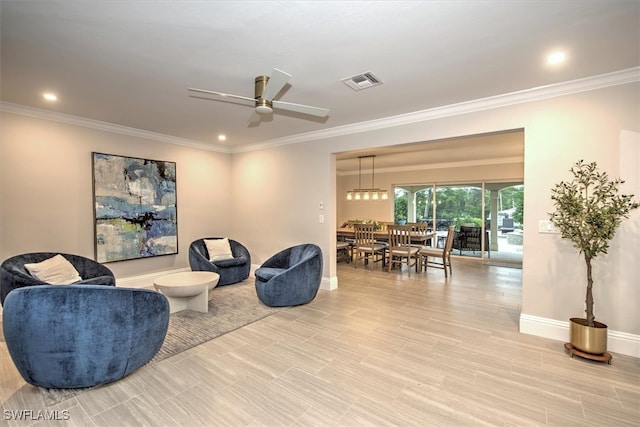 living room with ceiling fan and crown molding