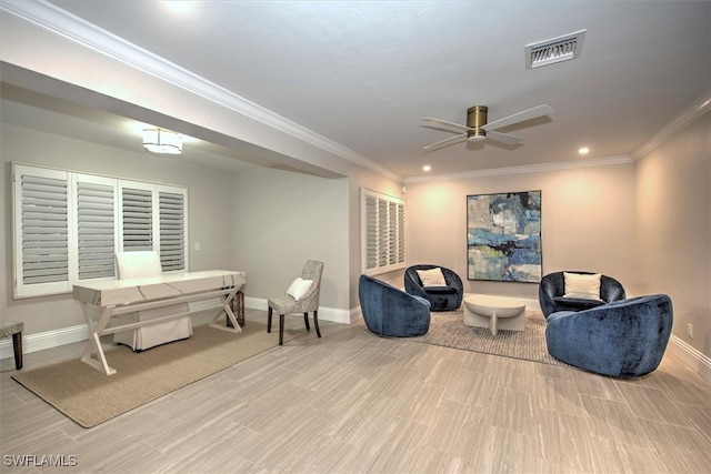 living area with ceiling fan and ornamental molding