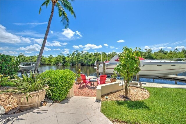 exterior space with a dock and a water view