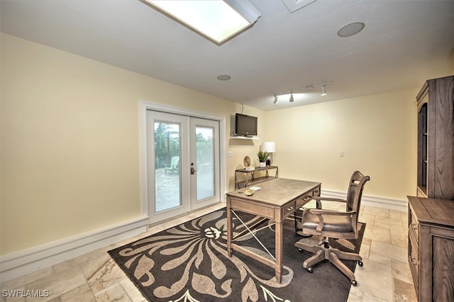 office space with light tile patterned flooring, rail lighting, and french doors