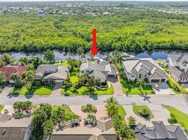 birds eye view of property with a water view