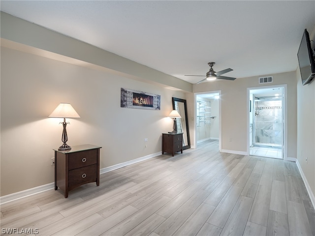 interior space with ceiling fan and light hardwood / wood-style floors