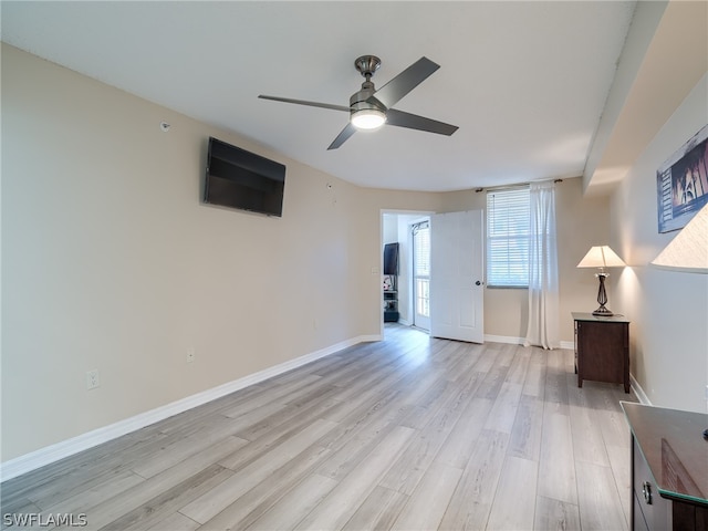 unfurnished living room with ceiling fan and light hardwood / wood-style floors