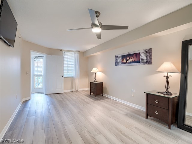 interior space with ceiling fan and light hardwood / wood-style flooring