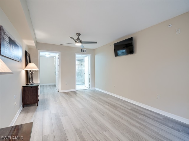 unfurnished living room with ceiling fan and light wood-type flooring