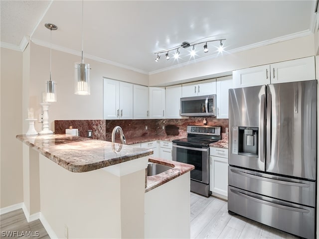 kitchen with pendant lighting, white cabinetry, kitchen peninsula, and stainless steel appliances