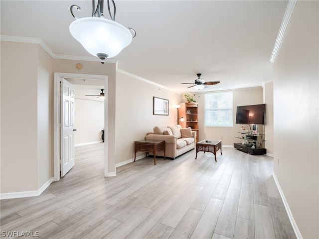 unfurnished living room featuring light hardwood / wood-style floors, ceiling fan, and ornamental molding