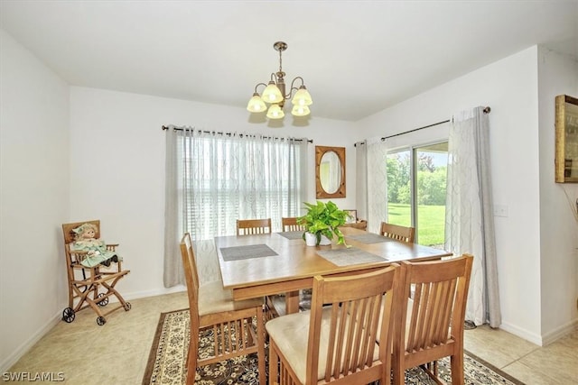 dining space featuring a chandelier and light tile patterned floors