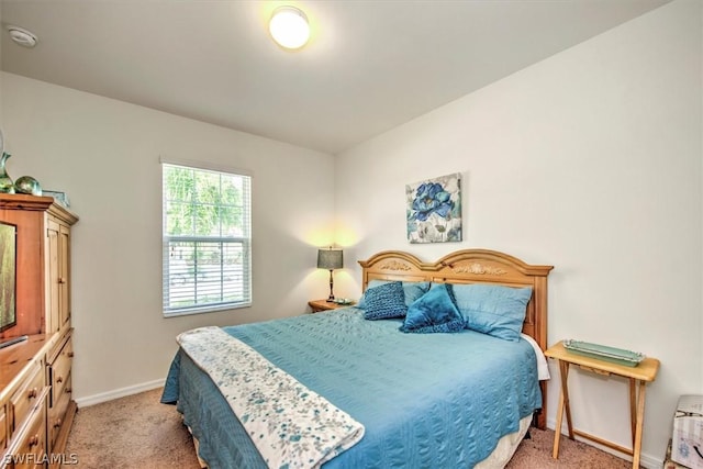 bedroom with light colored carpet